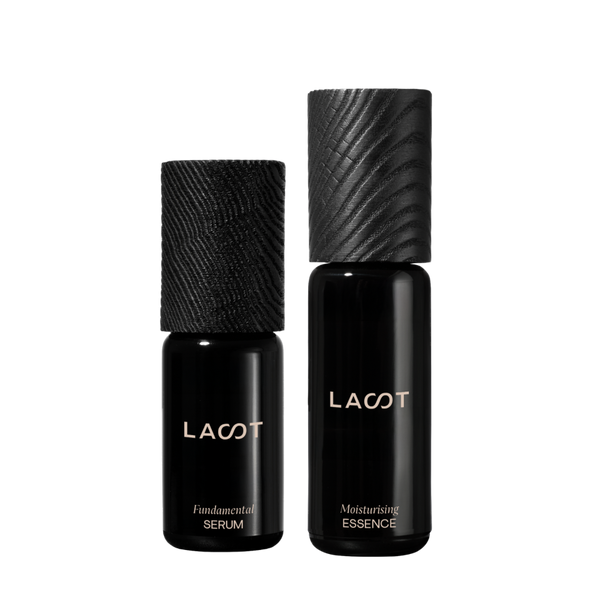 Two black bottles of LAST skincare products on a white background