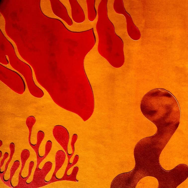 Abstract design with red and orange shapes on a textured background presenting how LAST neurocosmetics  work
