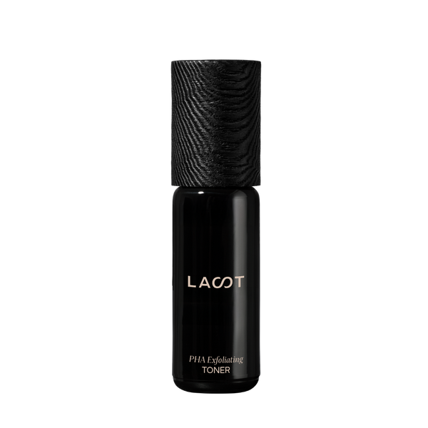 Black biophotonic PHA Exfoliating Toner bottle with 'LAST' branding on a white background